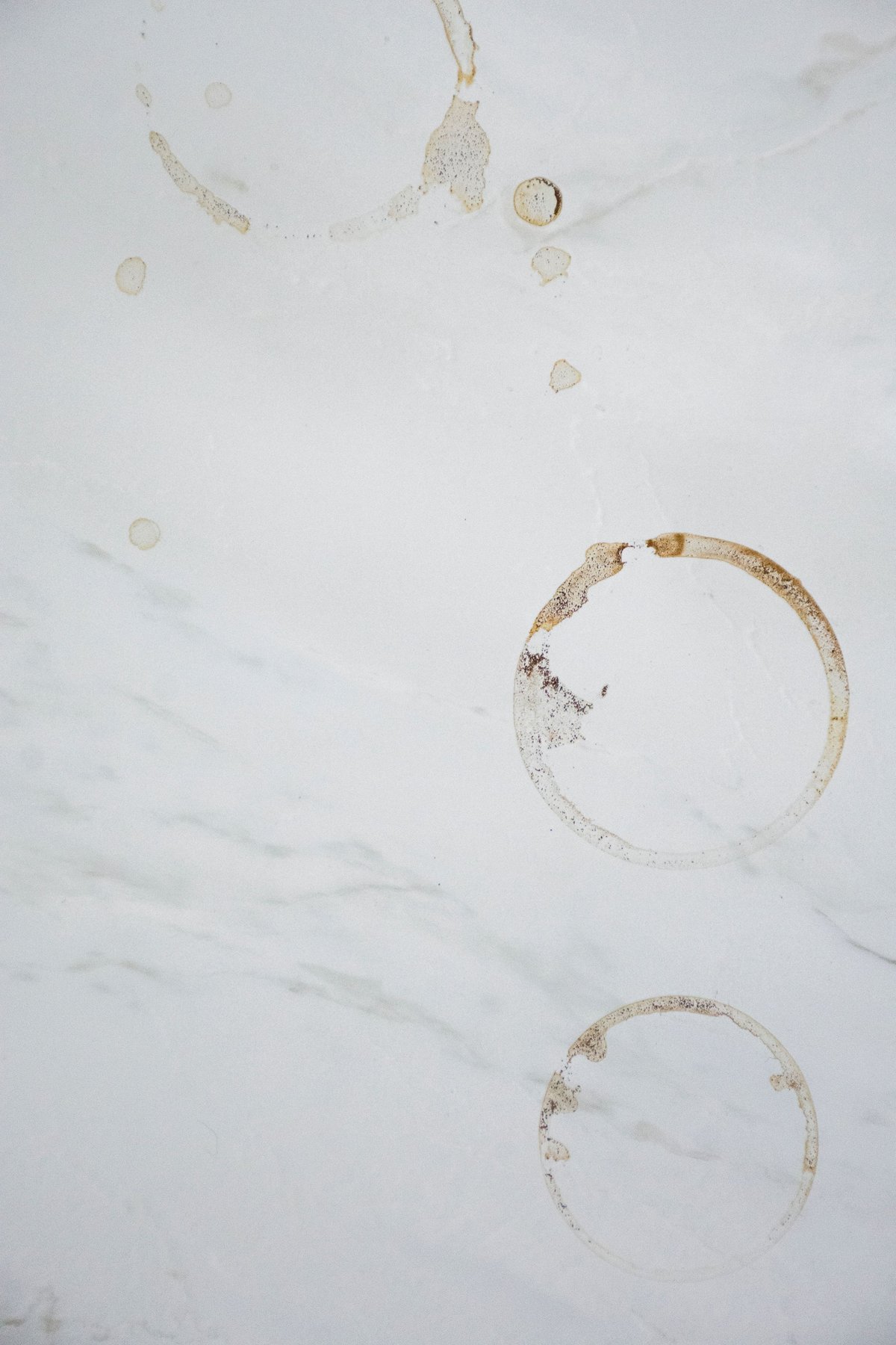 Coffee mug rings on marble surface