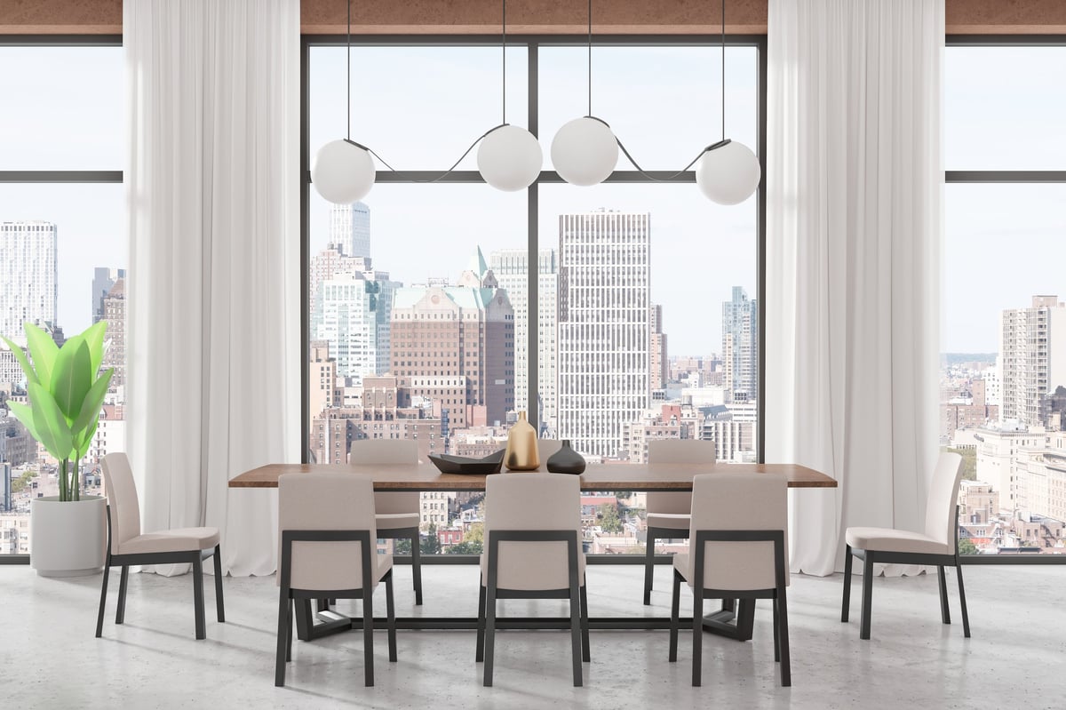 Stylish home living room interior with panoramic window on New York skyscrapers