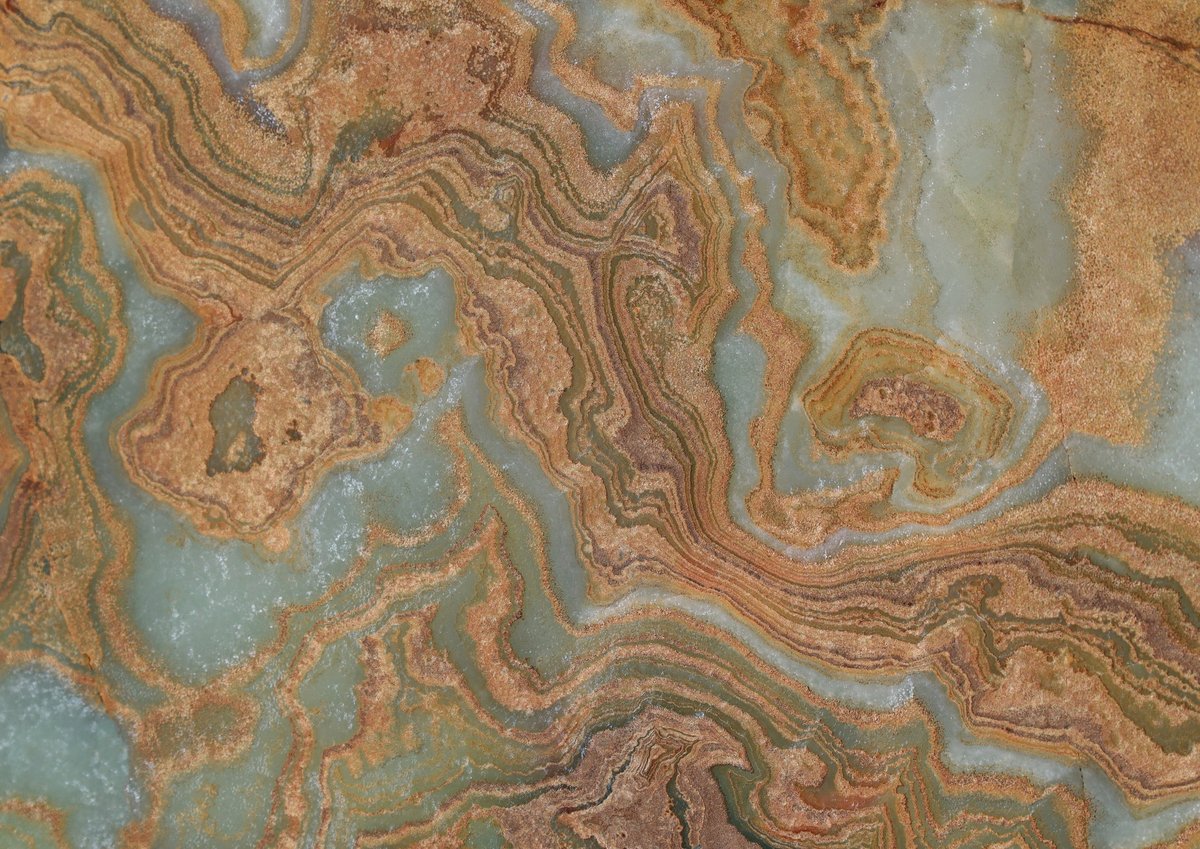 Slab of rainbow onyx with brown ochre pale green and off white bands